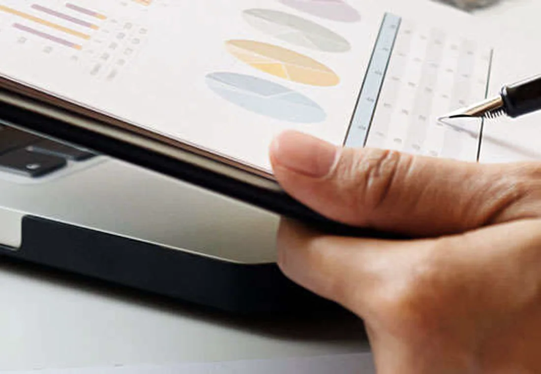 Reviewing financial documents at a desk